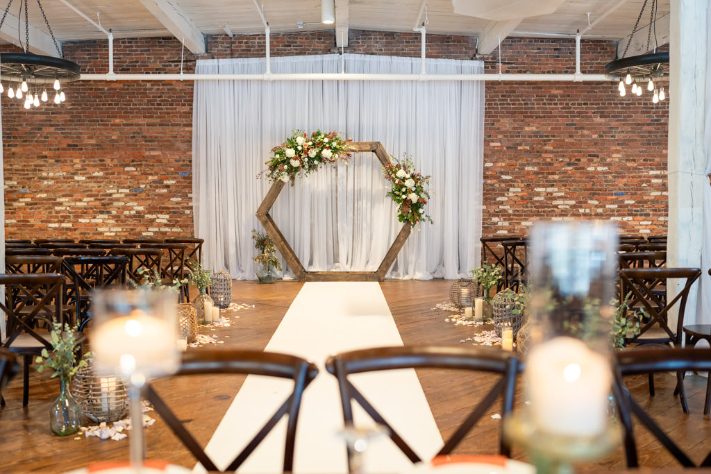 Ceremony setup with hexagon arch captured by Monroe GA wedding photographer