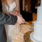 Monroe GA wedding photographer captures cake cutting at The Factory at Walton Mill