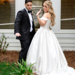 Bride and groom outside 173 Carlyle House wedding venue in Norcross GA during spring