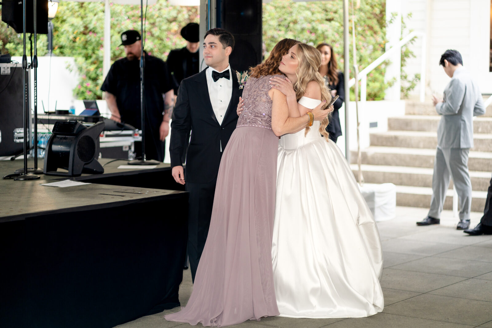 Bride embraces her mother in law with a heartfelt hug after a touching wedding speech at The 173 Carlyle House.