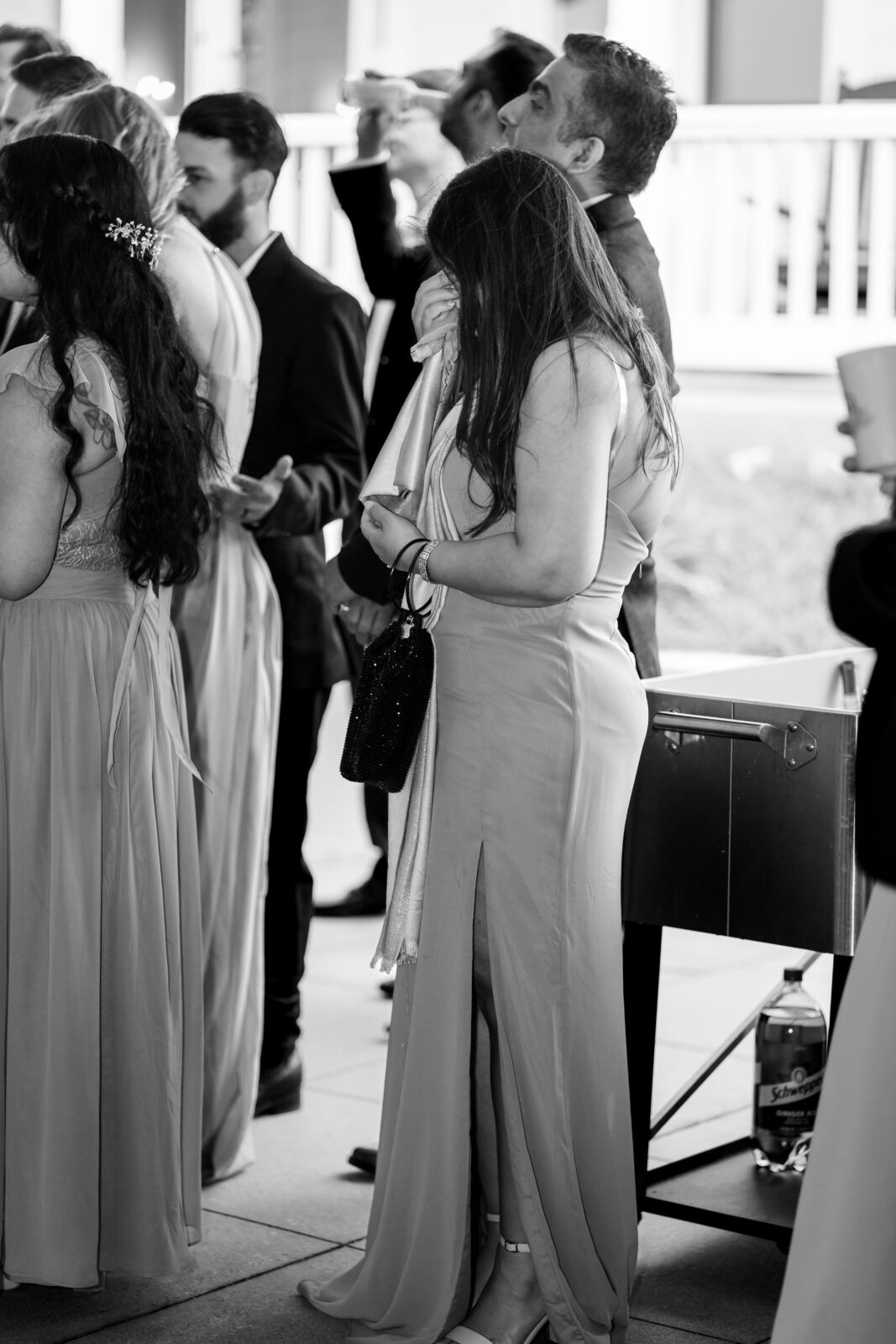 A wedding guest wipes away tears during an emotional speech at The 173 Carlyle House celebration.