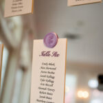 Wedding guest seating chart with lilac wax seal for spring wedding at Carlyle House