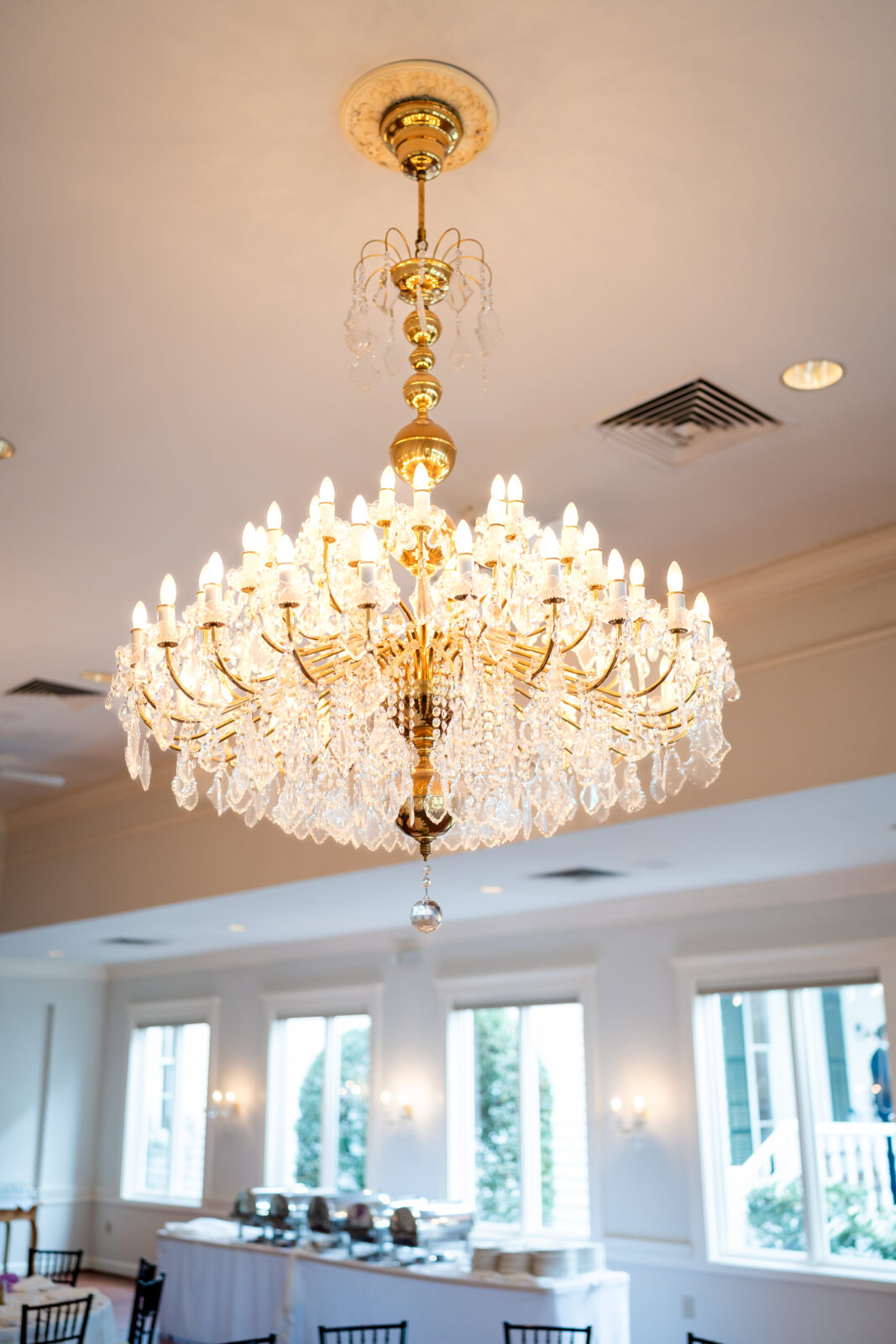 Elegant crystal chandelier in the ballroom at 173 Carlyle House wedding venue in Norcross, Georgia