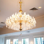 Elegant crystal chandelier in the ballroom at 173 Carlyle House wedding venue in Norcross, Georgia