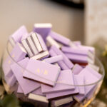 Personalized purple matchboxes as wedding favors at Carlyle House reception