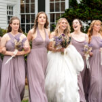 ride and bridesmaids in lilac dresses with spring florals at Carlyle House wedding