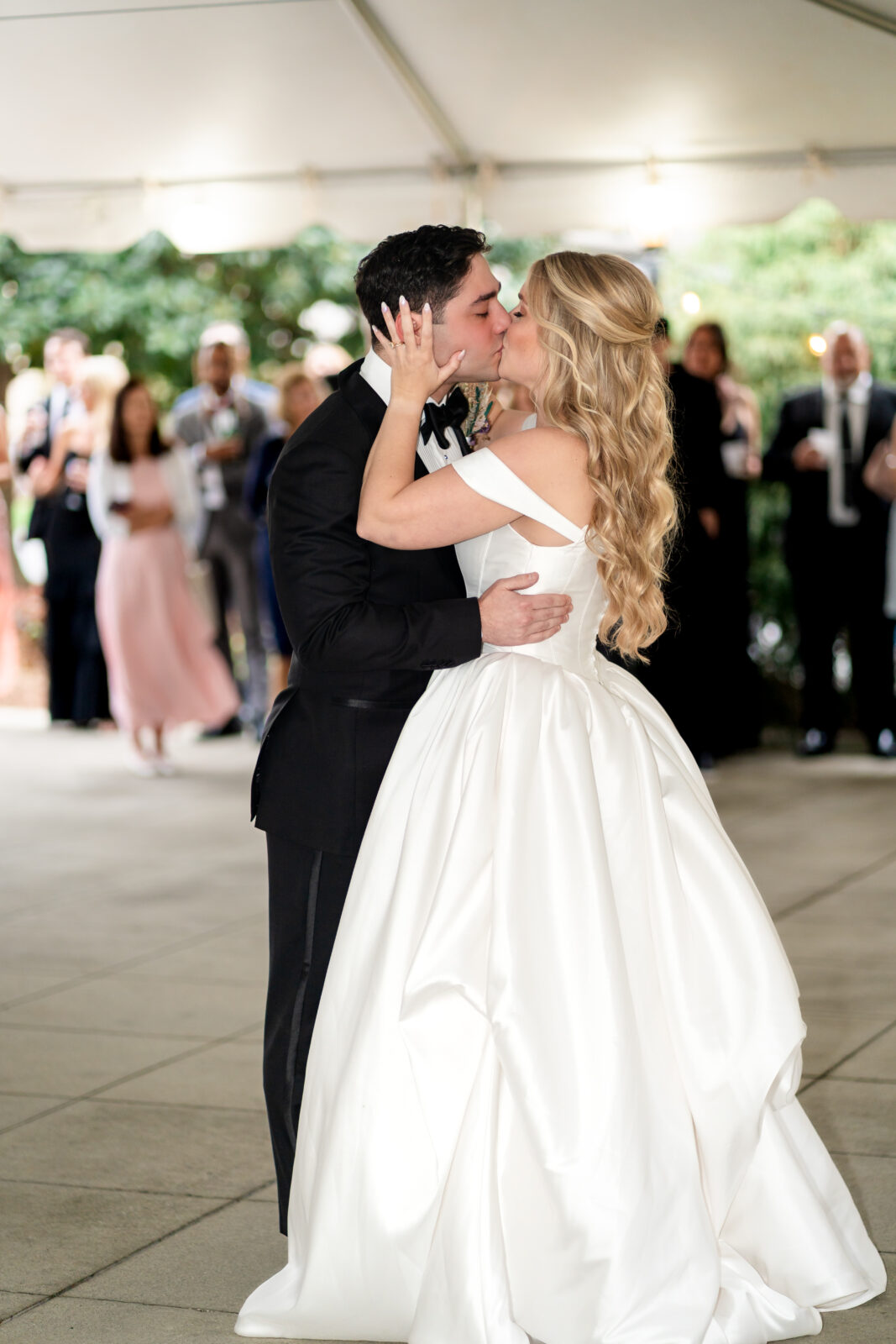 Bride and groom sharing a kiss during their romantic first dance at Carlyle House