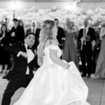 Excited bride and groom make a grand entrance at 173 Carlyle House wedding in Norcross GA