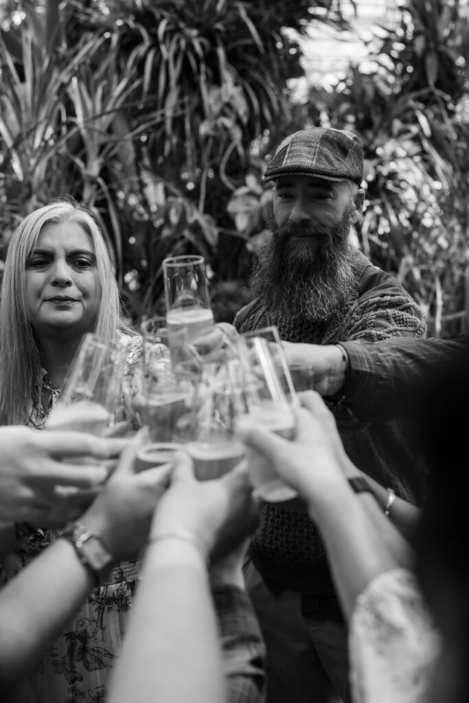 Guests raising glasses for a toast after engagement announcement
