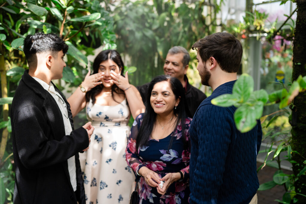 Family members celebrating with couple after the proposal