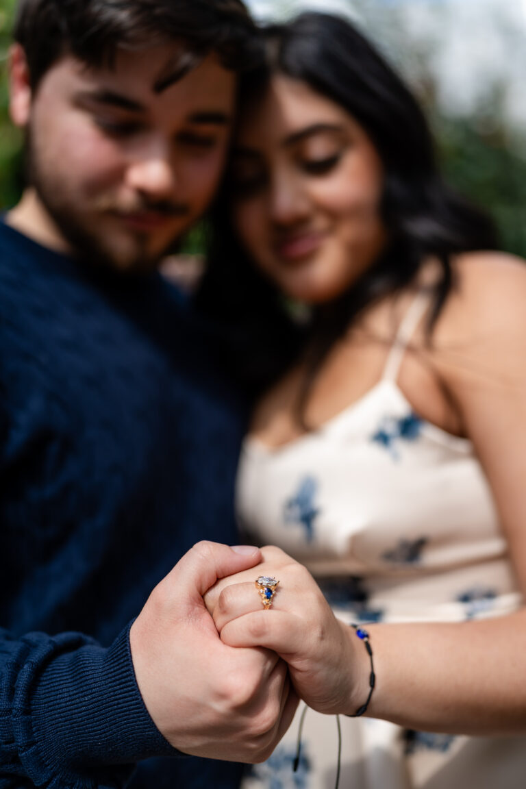 Close-up of engagement ring on bride’s hand after proposal