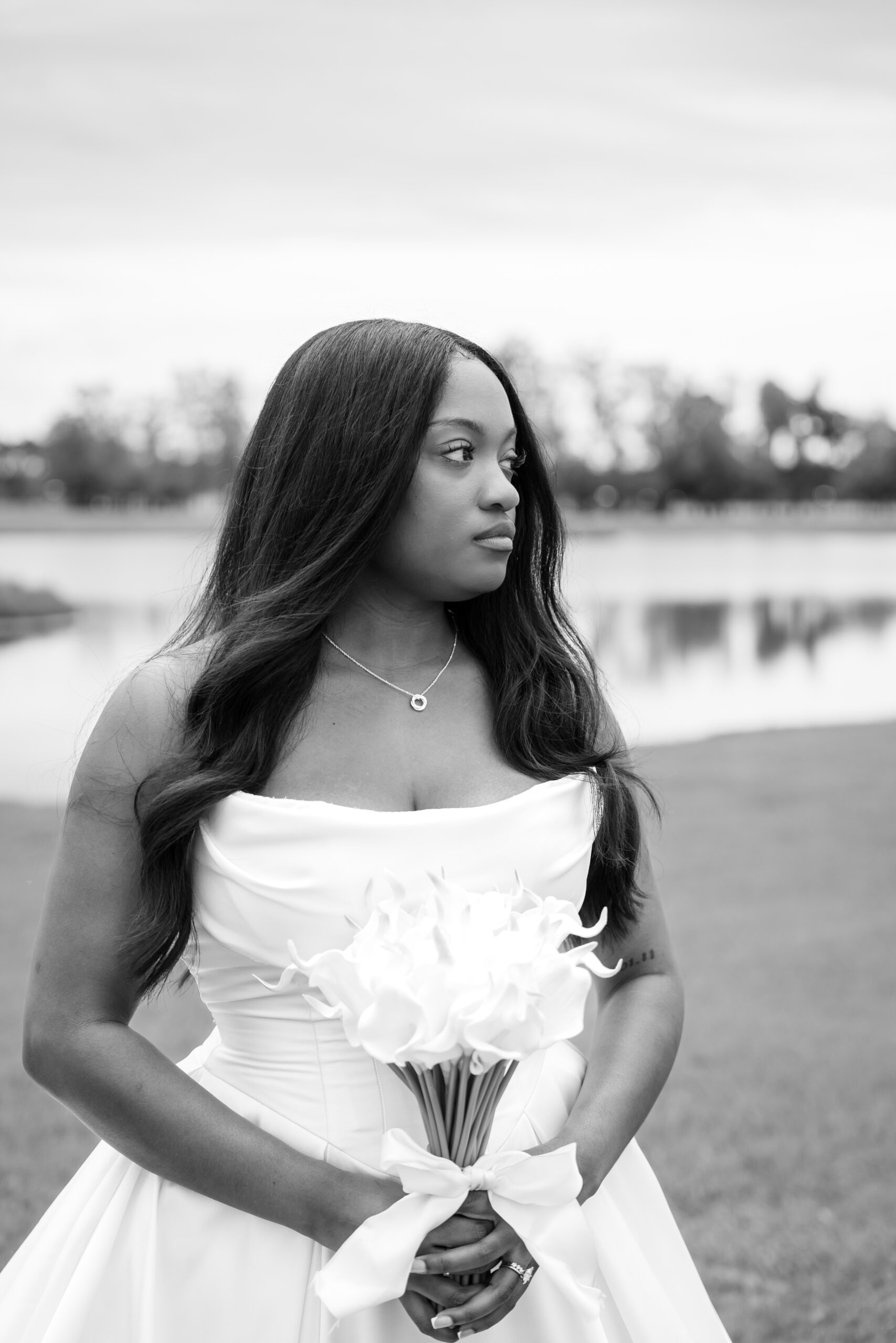 Timeless black and white bridal portrait with calla lily bouquet at Chateau 1800 in Rincon, Georgia.