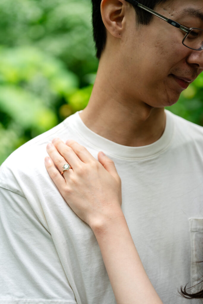 Close-up of engagement ring on bride’s hand after proposal