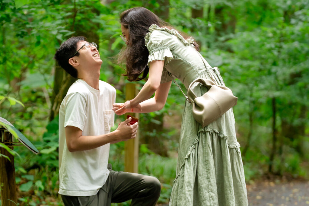 Bride reacting with joy and laughter during surprise proposal