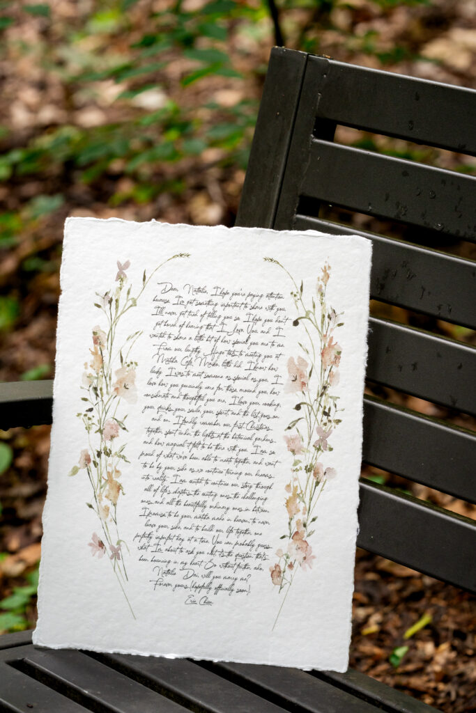 Romantic surprise proposal Atlanta letter on bench