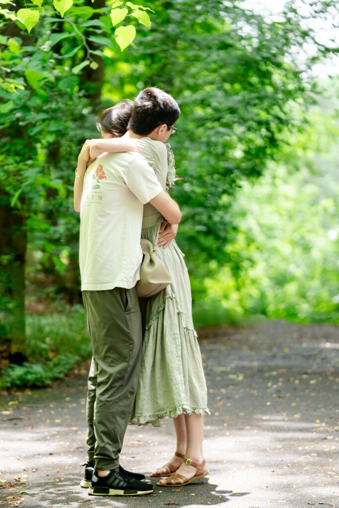 Emotional hug after proposal at Fernbank Forest Atlanta