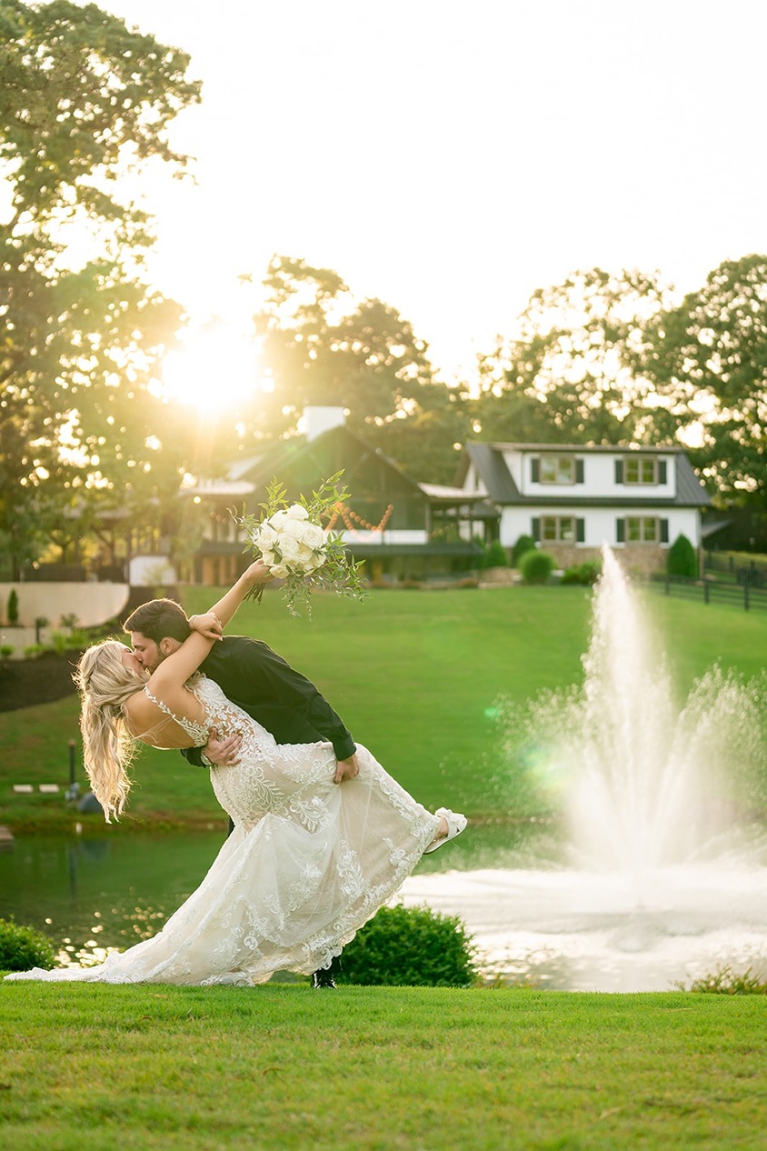 the bride and groom outside of the revere, a unique wedding venue in north georgia