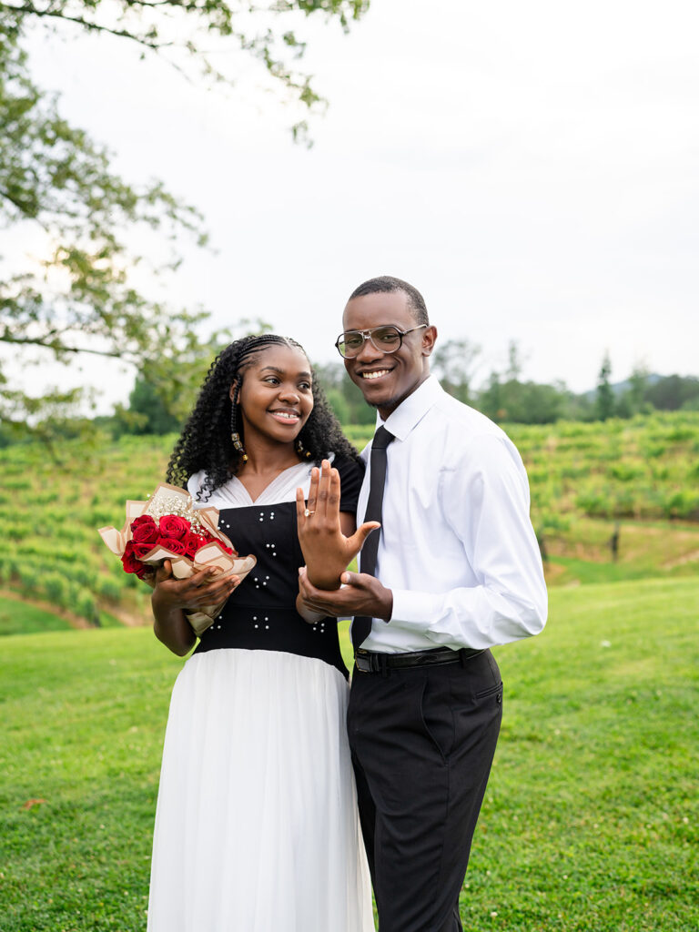 Atlanta Proposal Packages - Kalyn Wolf Studios Couple sharing photos of ring during their marriage proposal Atlanta session.