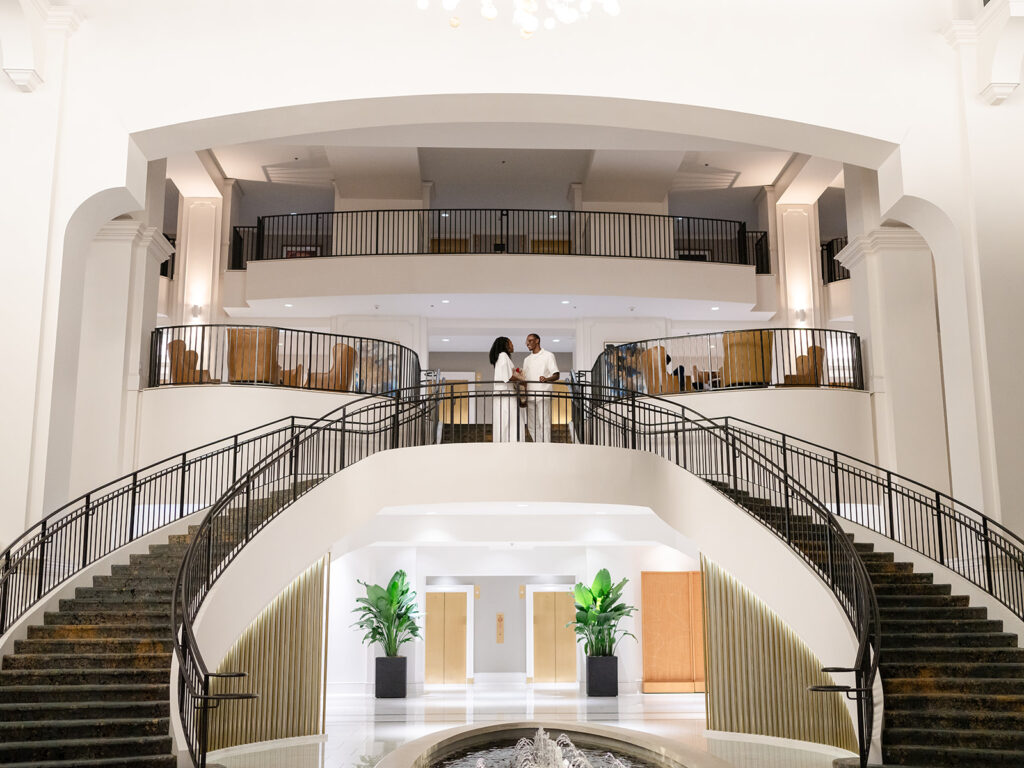 Engaged couple on the grand staircase of Château Élan Winery after saying yes. 