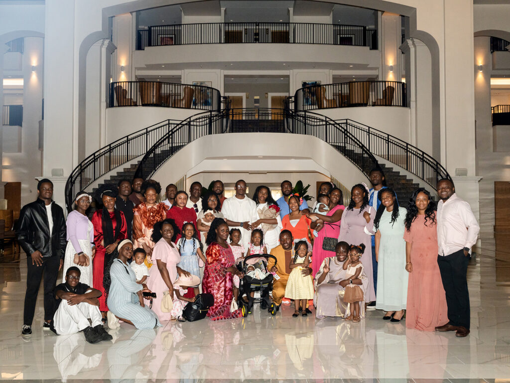 Joyful family photo at Versaille Restaurant Château Élan after winery proposal