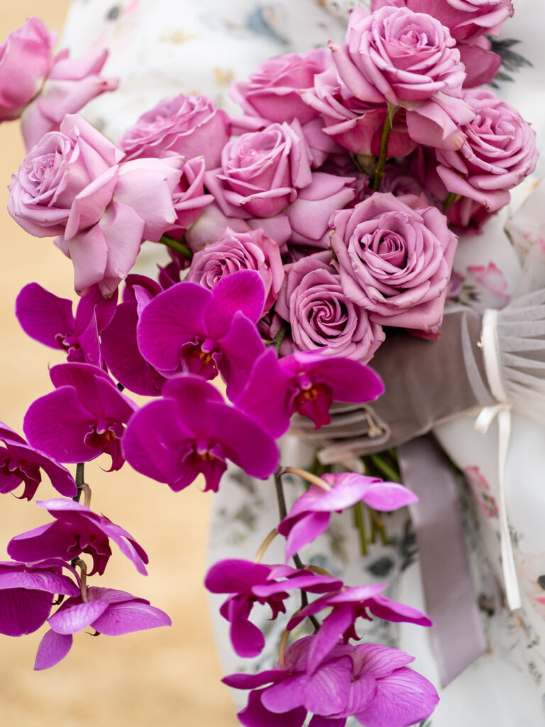 Bright pink bridal bouquet with layered seasonal florals representing average wedding cost in Georgia.