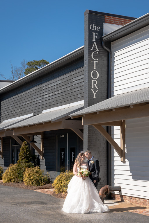 Average Cost of a Wedding in Georgia | Kalyn Wolf Studios Bride and groom walking together after ceremony at The Factory, reflecting average cost of a wedding in Georgia.