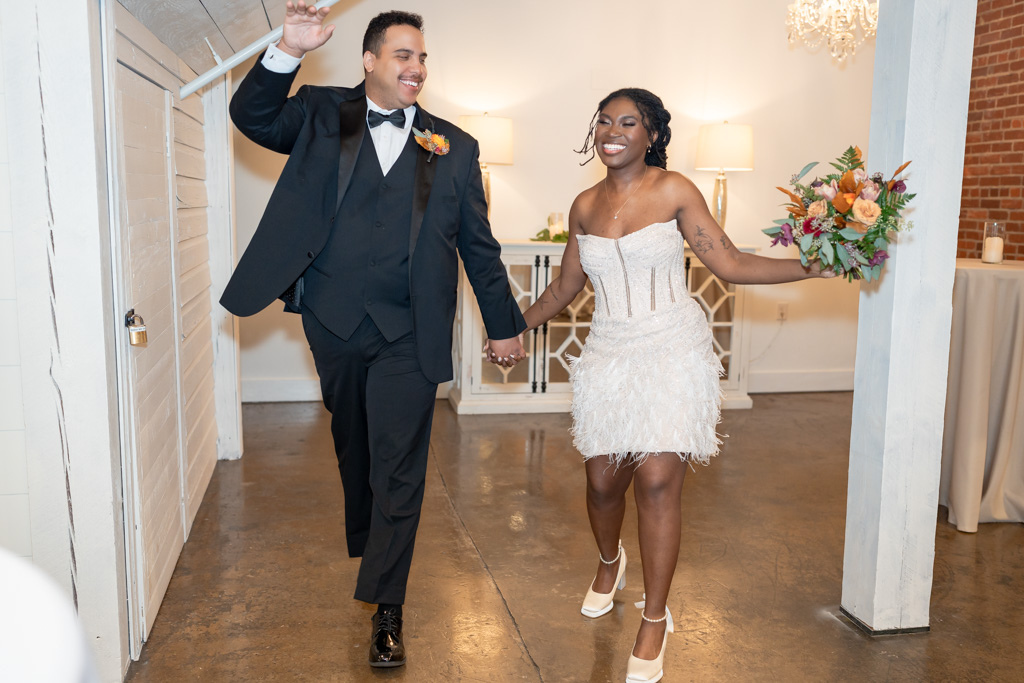 Bride and groom walk down the aisle celebrating how to get married in Georgia