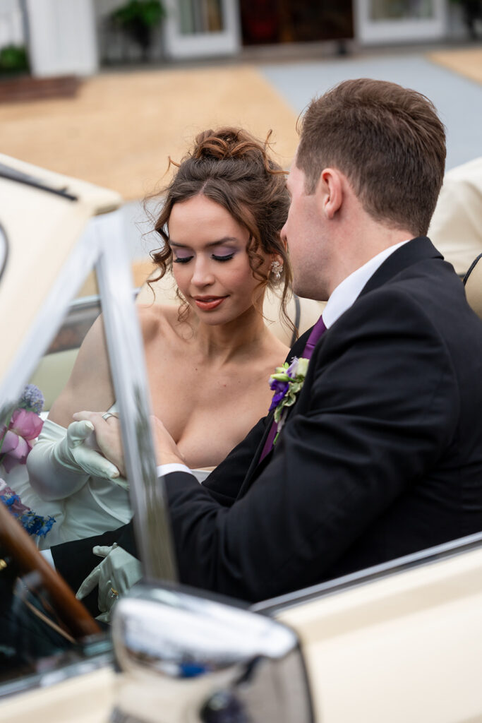 Georgia Wedding Photography Videography | Kalyn Wolf Studios Bride and groom sharing a quiet moment in a vintage car during a Georgia wedding photography videography session.