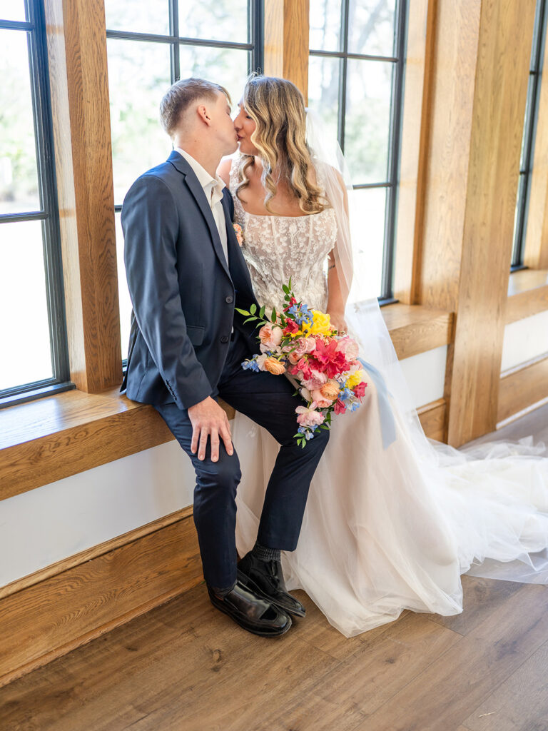 Wedding Photography in Georgia | Kalyn Wolf Studios Bride and groom sharing a window-side portrait during a wedding photography Georgia celebration.