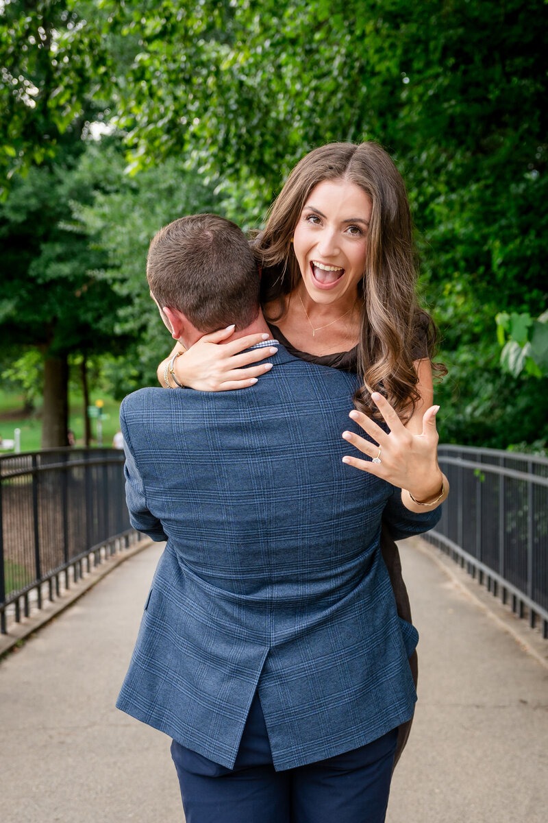 Candid Georgia engagement photos of a couple laughing together.