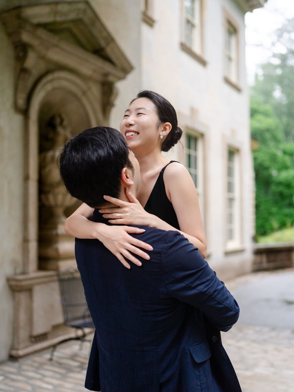 Romantic Georgia engagement photos of a couple embracing outdoors.