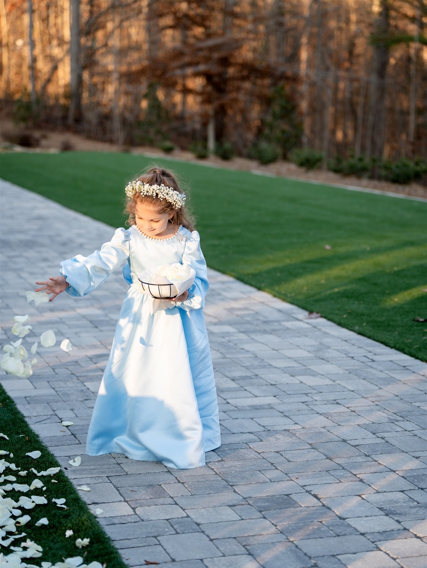Flower girl walking during the wedding ceremony at Dunagan Hills